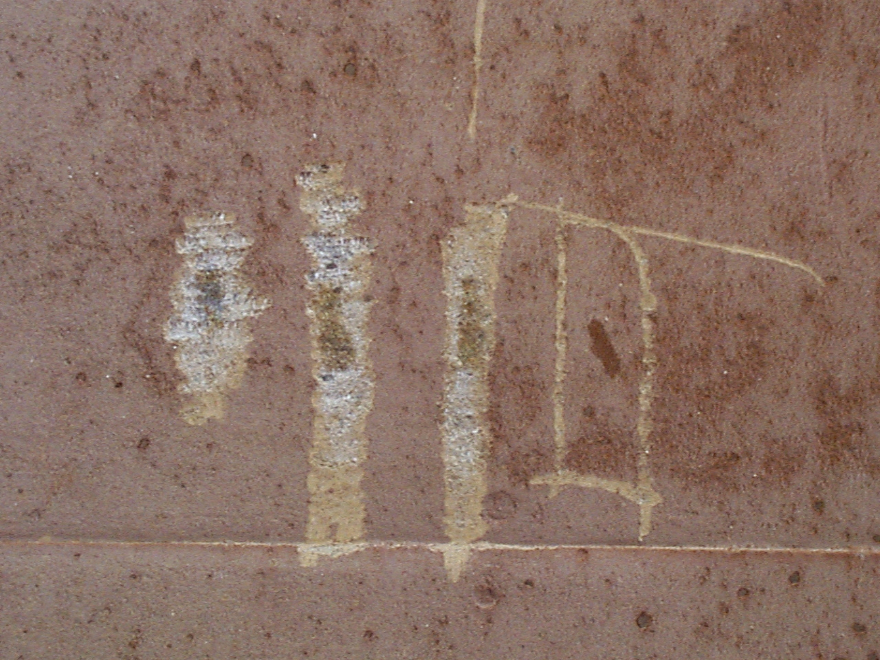 Figure 4 - Concrete Damage by Carbonation below Water Line; Scraped to Determine Depth of Attack.