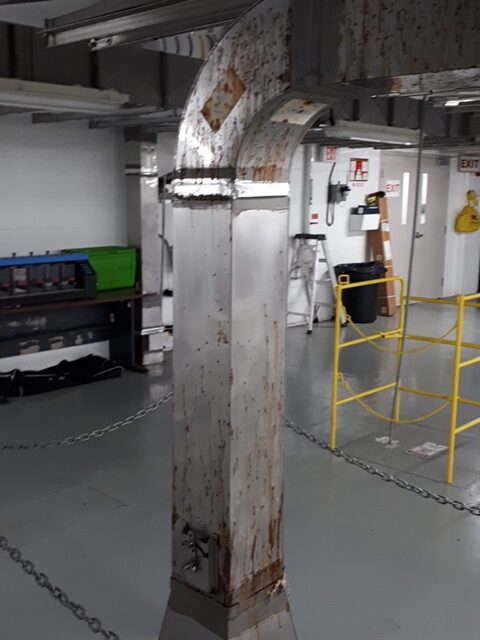 Figure 5. Pitting corrosion of Type 316L stainless steel foul air ductwork.