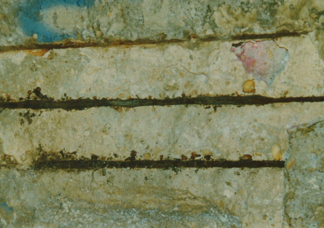 Figure 6 - Rusting Rebar Has Cracked Overlying Concrete, Exposing Rebar
